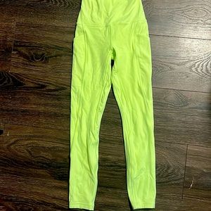Never worn, bright yellow green, lululemon ,size zero